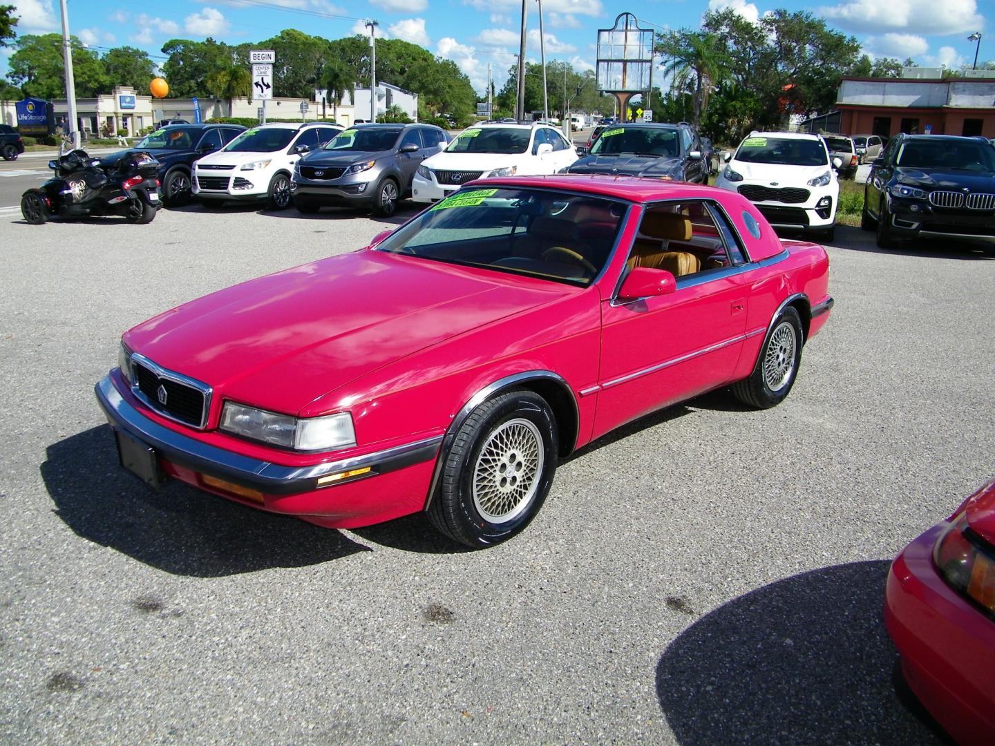 1991 Red /Beige Chrysler TC By Maserati Convertible (ZC2FS1207MB) with an 3.0L V6 SOHC 12V engine, 4-Speed Automatic Overdrive transmission, located at 4000 Bee Ridge Road, Sarasota, FL, 34233, (941) 926-0300, 27.298664, -82.489151 - Photo#0